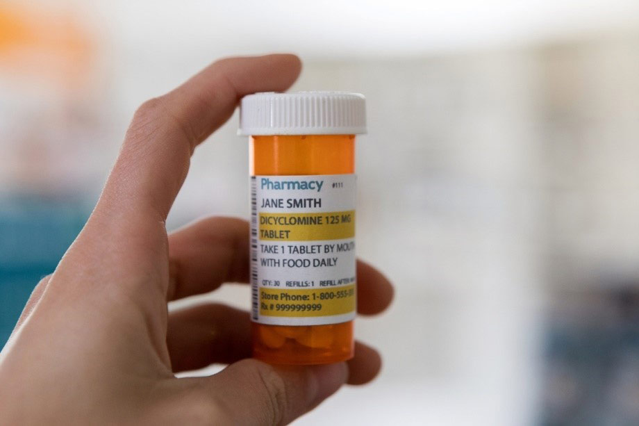 Medication bottle with take with food label